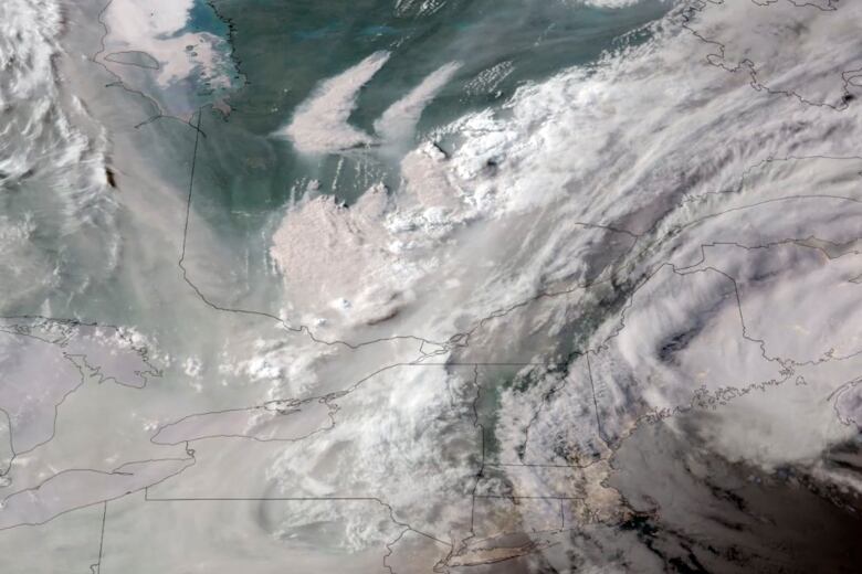 A satellite photo of wildfire smoke.