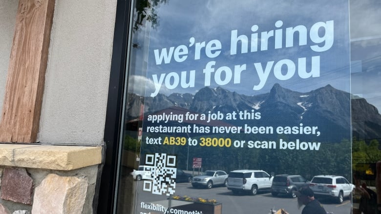 A hiring sign is pictured at a McDonald's restaurant in Canmore, Alberta.