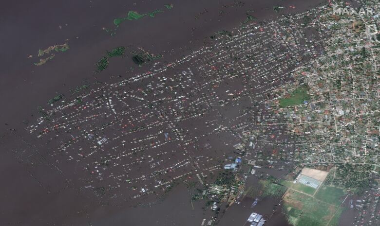 An aerial view of a flooded town.