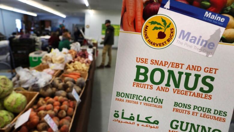 Vegetables for sale are visible next to what is probably a flyer written in multiple languages. The English text says 