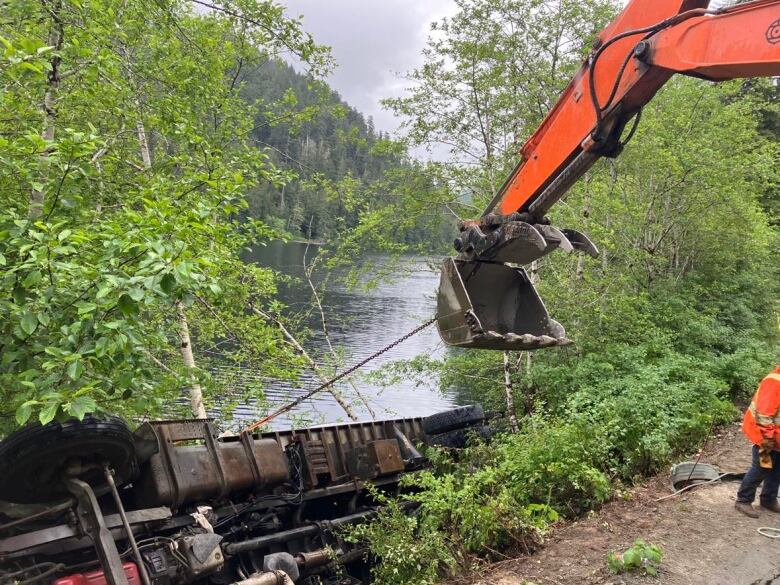 On Friday June 9, 2023, crews removed a commercial vehicle from Francis Lake on Vancouver Island that had rolled while travelling along a Highway 4 detour.