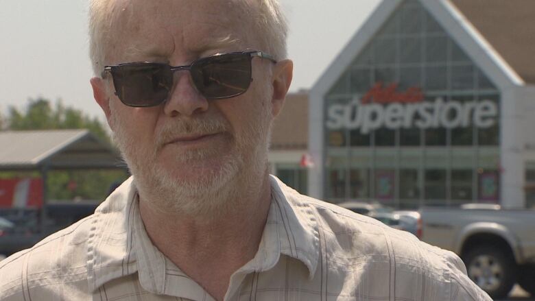 John McCracken stands in front of Superstore in Upper Tantallon, N.S. 