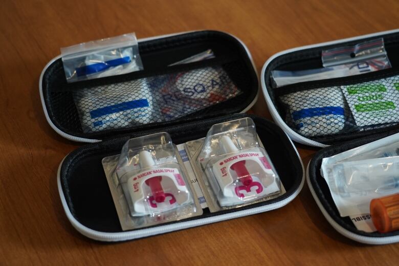 An open naloxone kit showing Narcan and the other supplis provided. 