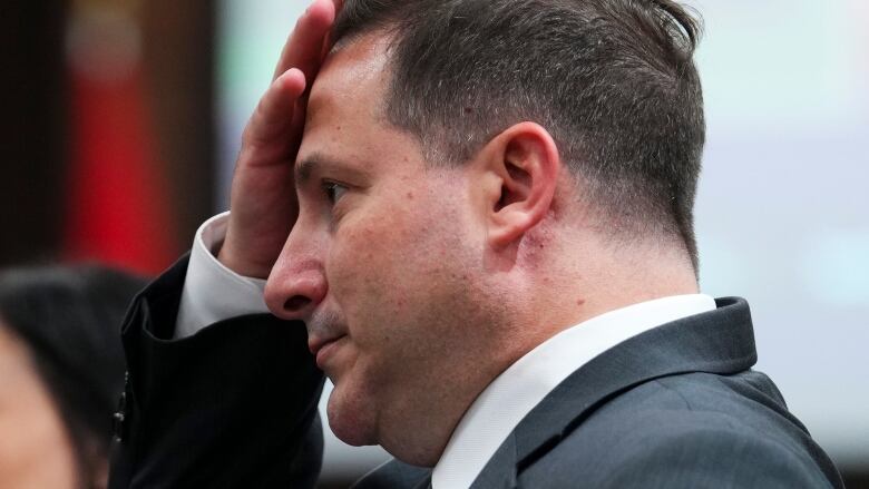 Public Safety Marco Mendicino wipes his brow after an appearance at a Commons committee meeting.