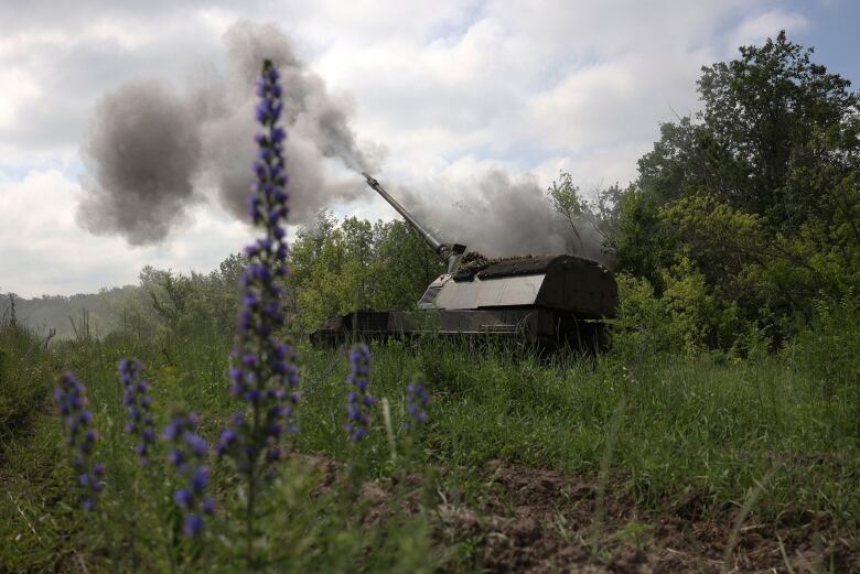 A Ukrainian howitzer is seen firing toward Russian positions near Bakhmut, Ukraine.