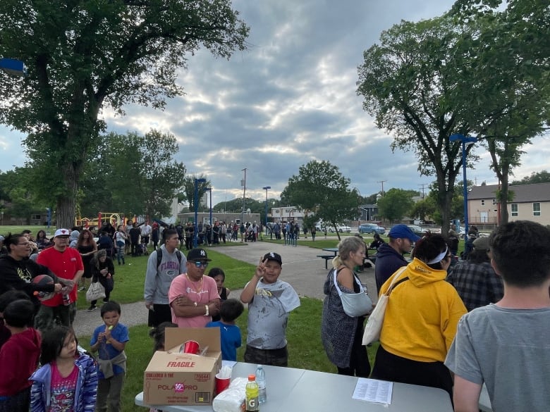 Hundreds of people lining up for free meals at Pepsi Park in Downtown Regina on Thursday night. 