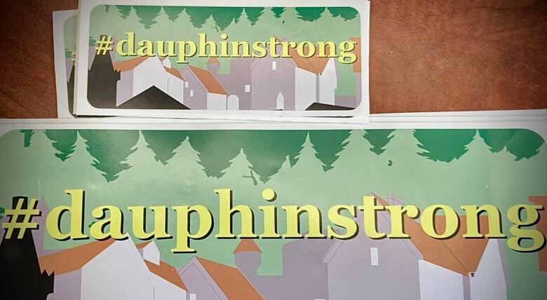 A decal sticker that says 'dauphin strong' is shown.