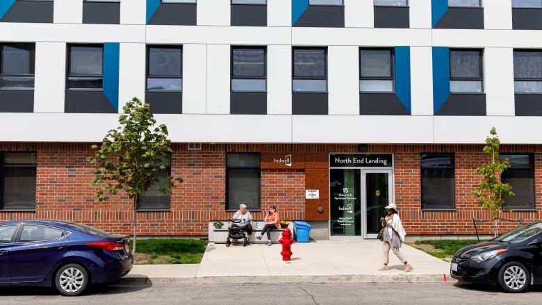 The front of a new, sustainable apartment building.