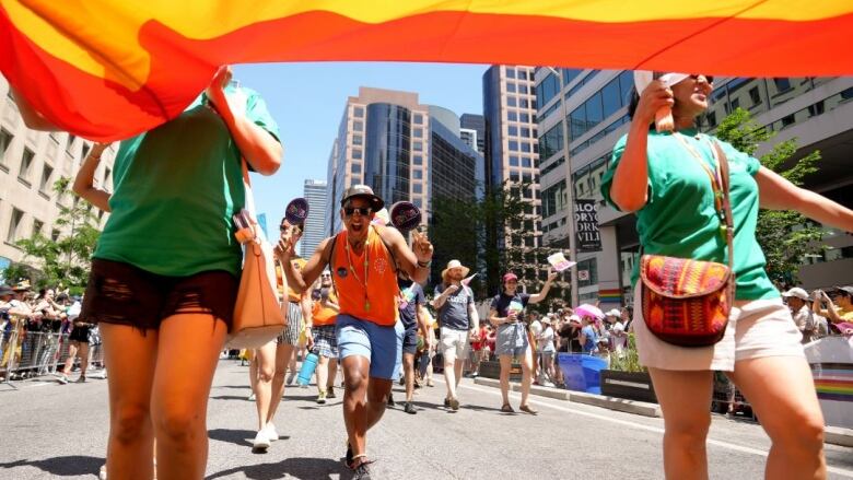 Participants walk in the Toronto Pride Parade, in Toronto, Sunday June 25, 2023.