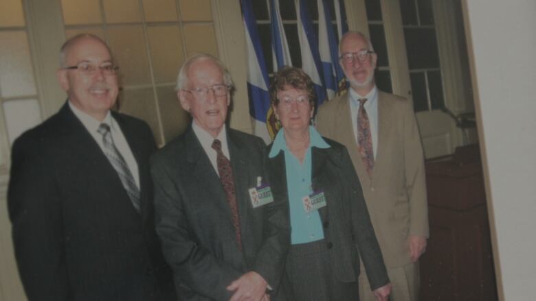 Cyril Giffin stands in the middle of four people, one of which is Ross Landry the former minister of justice. 