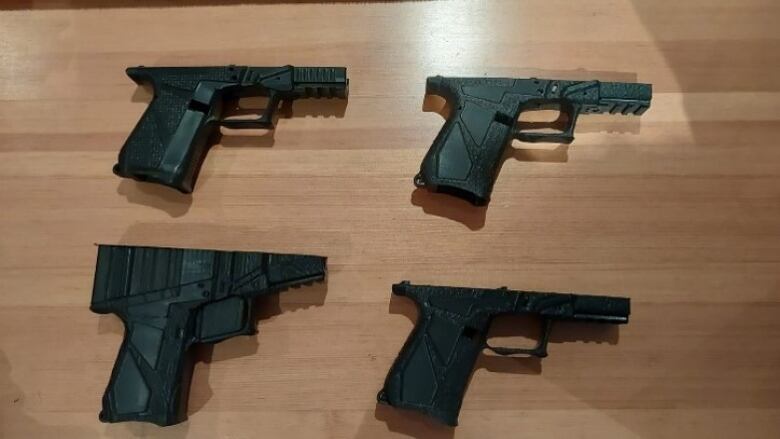 An image of four 3D-printed firearm receivers seized in a raid on Calgary-area homes on June 20, 2023. 