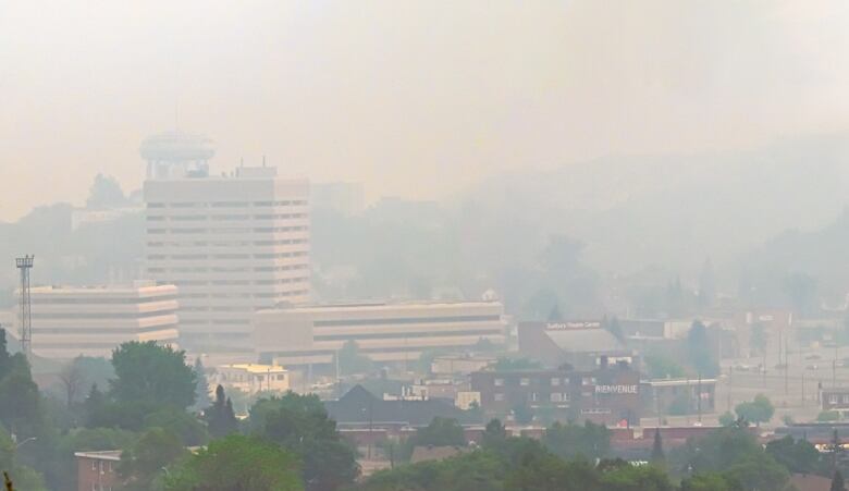 A landscape image of a smoky city.