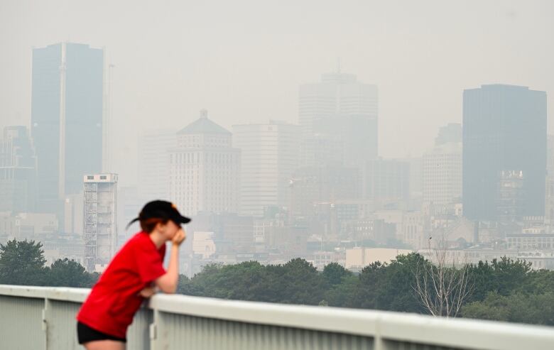 The skyline of Montreal is obscured by a haze of smog, Sunday, June 25, 2023, as a smog warning is in effect for Montreal and multiple regions of the province due to forest fires. 