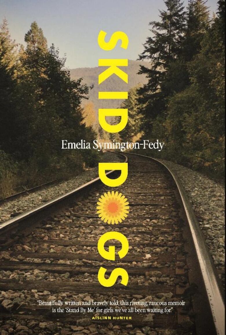 A book cover of a train track surrounded by green trees.