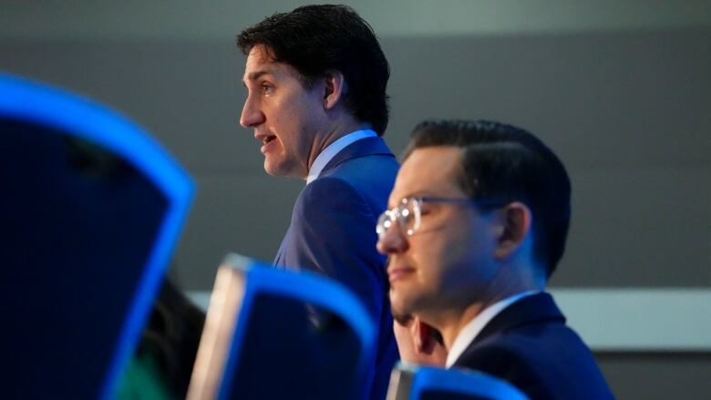 Prime Minister Justin Trudeau and Conservative Leader Pierre Poilievre take part in the National Prayer Breakfast in Ottawa on Tuesday, May 30, 2023.