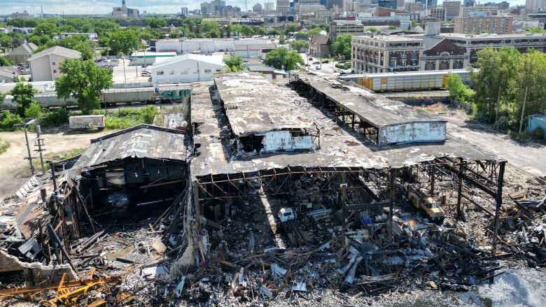 A wide view of a large burned down building. 