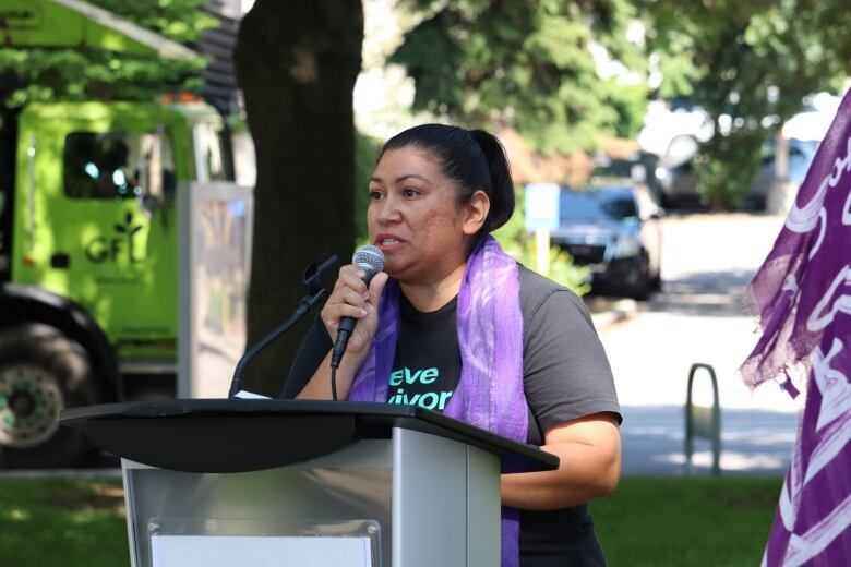 Woman at a podium. 