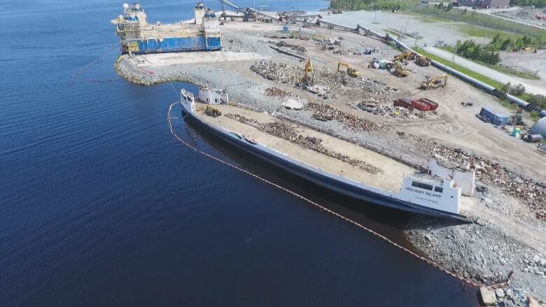 Drone footage of the MV Holiday Island in recent weeks shows only the hull remains of the ferry.