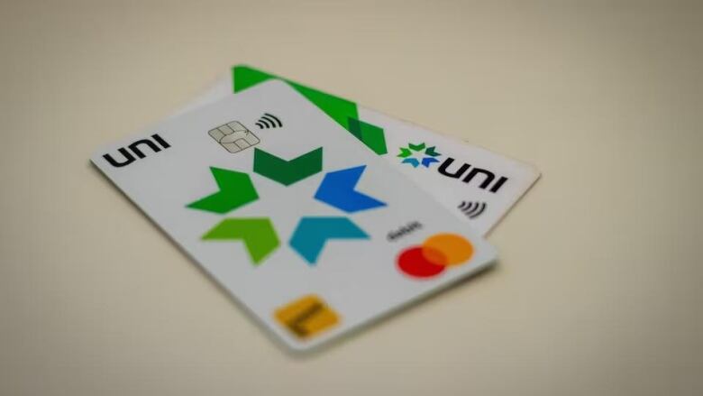 Two white debit cards with 