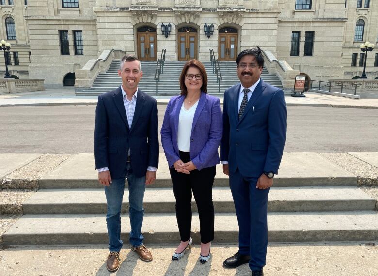 Carla Beck with the two NDP byelection candidates, Jared Clarke (left) and Noor Burki (right).