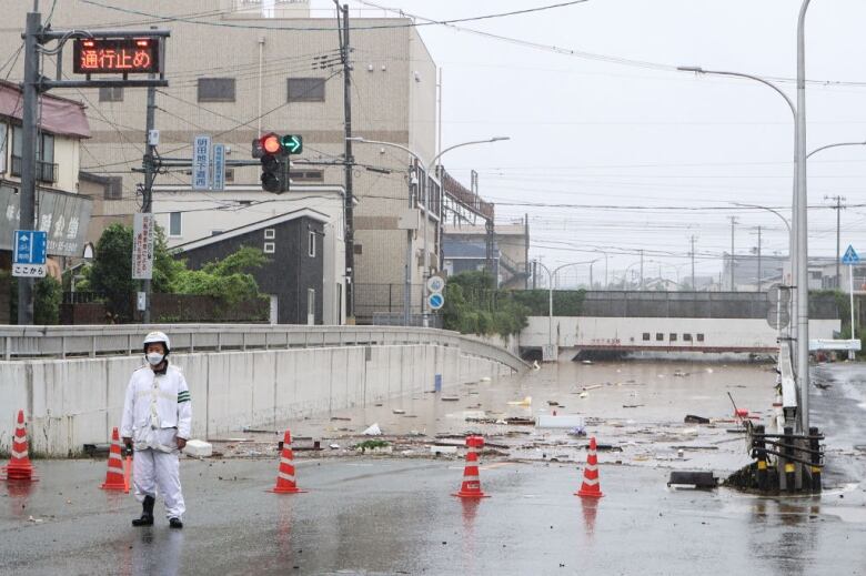 A closed-off flooded street.