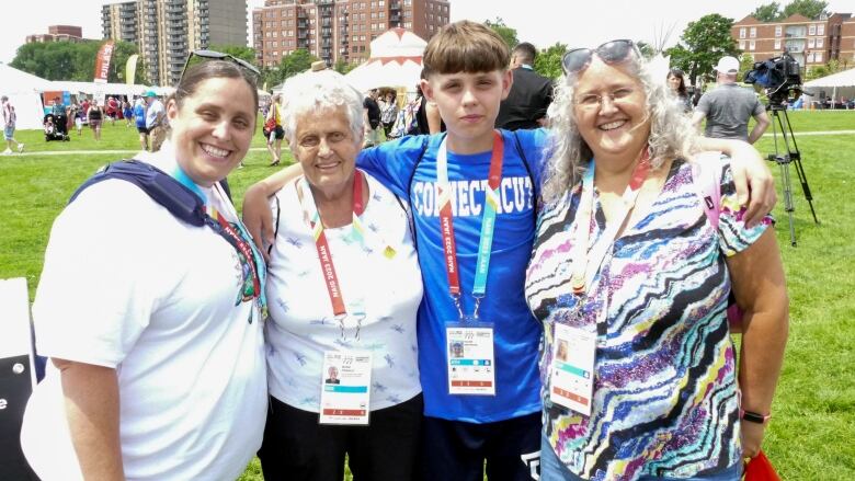 A mother, Great grandmother, son and grandmother pose together at NAIG's cultural village at the Halifax Common's park. 