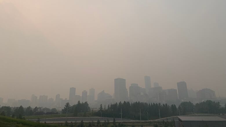 A haze appears over Edmonton's downtown skyline. 