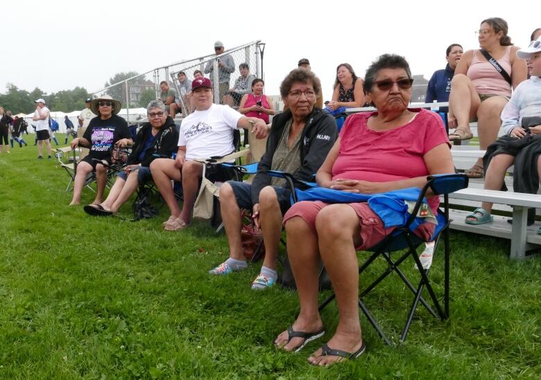 A group of kokums, or Cree grandmothers, gather on the sidelines of a sporting event in Halifax, Nova Scotia.