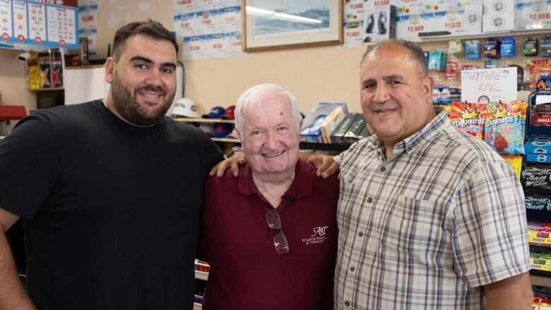 From right to left, Freddy Diab, Mike Brownlow, a family friend and customer, and Freddys dad Tony, one of the Expressway store owners. 