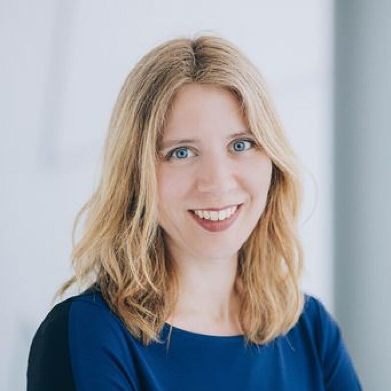 A woman poses for a photo