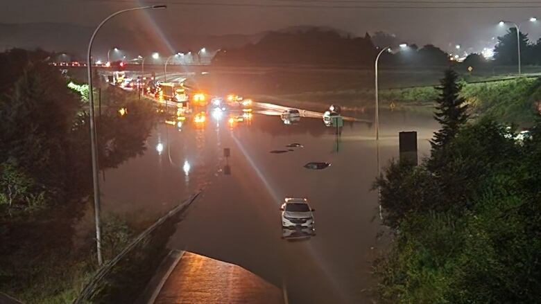 Cars are seen abandoned in water on Highway 101 outside of Halifax.