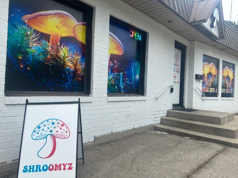 Magic mushroom storefront with mushroom photos in the windows