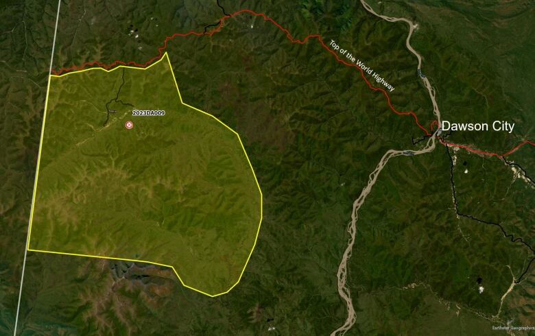 A satellite view map shows an area highlighted west of Dawson City.