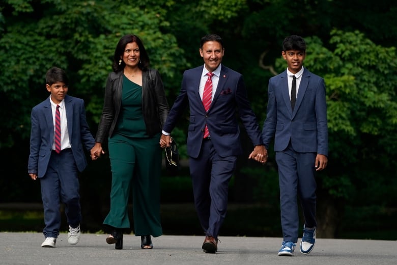 Arif Virani and his family arrive for a cabinet swearing-in ceremony at Rideau Hall in Ottawa on Wednesday, July 26, 2023.