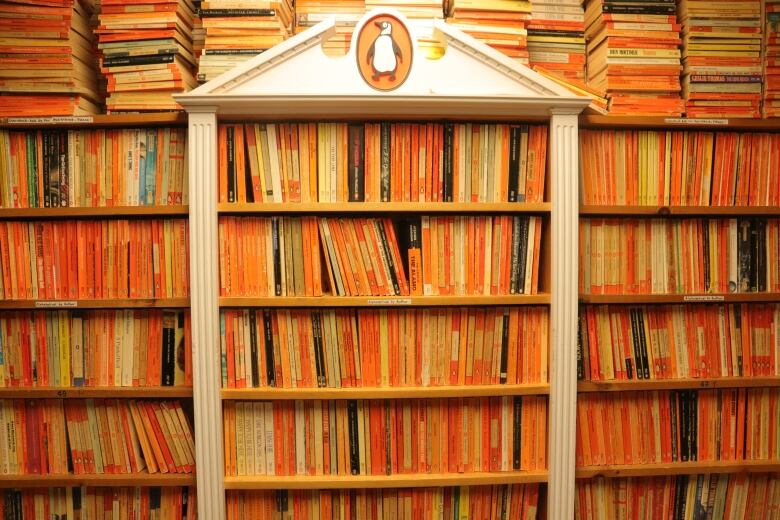 A wall of orange books, dedicated to Penguin paperbacks.