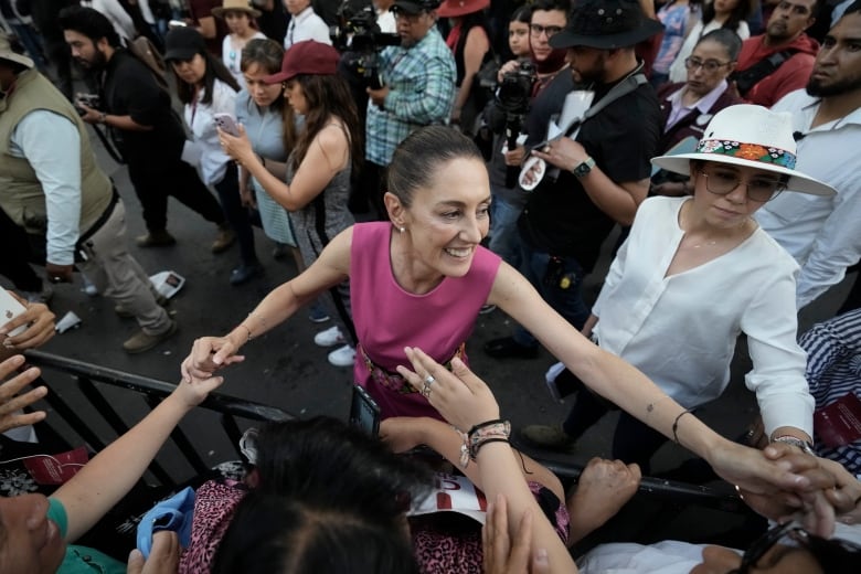 Mexico City Mayor Claudia Sheinbaum, right, greets supporters as she leaves a rally at the Revolution Monument in Mexico City on Thursday, June 15, 2023.