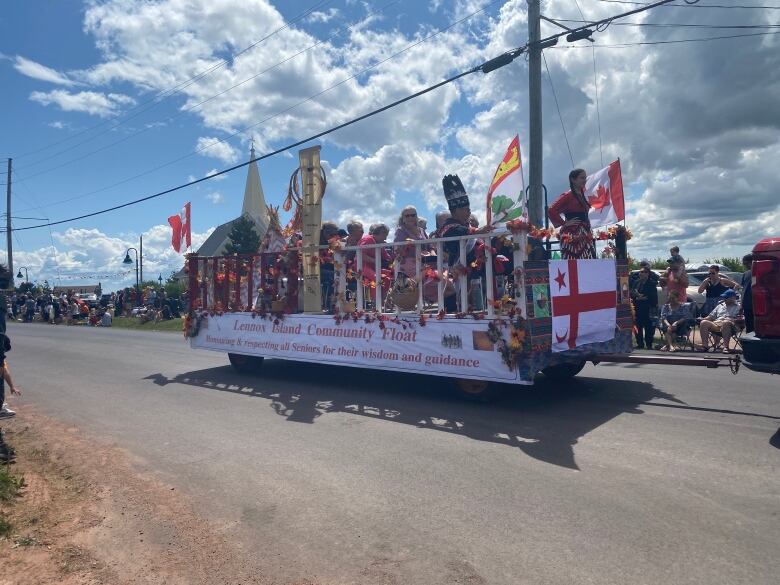 The Lennox Island Community Float was decked out with various flags.