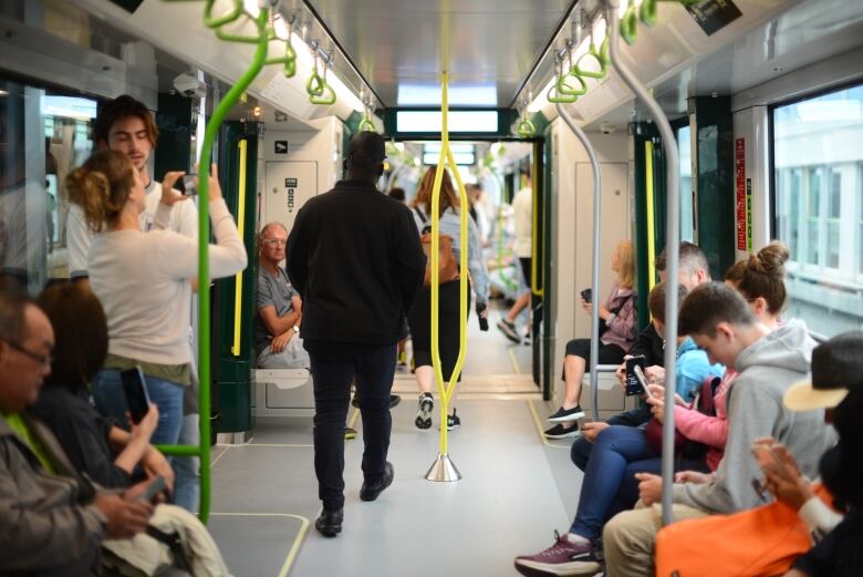 People walk through a train.