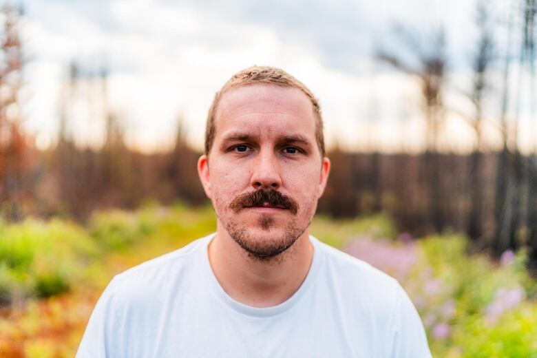 A man stands in a field.