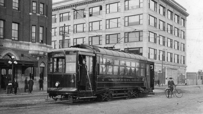 A black and white archival photo of a street car