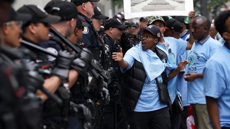 Toronto Police work the scene of a protest outside of the Sheraton Hotel in downtown Toronto, on Sunday, August 6 2023.