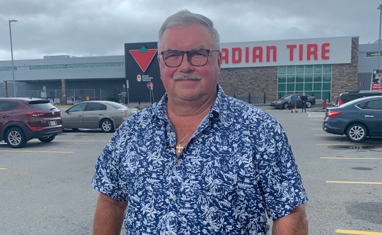 Bob Valcov stands in front of Canadian Tire. 