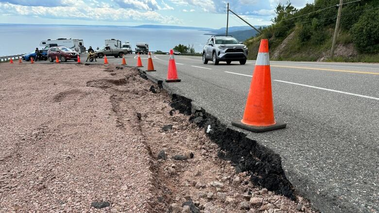 Pylons mark areas where gravel was washed away from the road after heavy rainfall in the Ingonish area. 