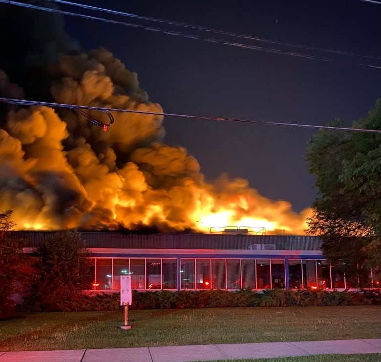 A five-alarm fire raged out of control at an industrial site in Etobicoke Friday.