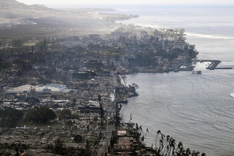 An aerial view show both the smokey harbour area and Lahaina town, in the aftermath of a wildfire that destroyed the town.