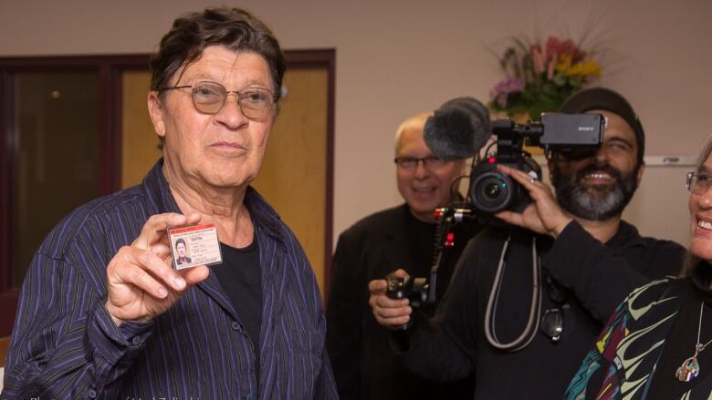 Robbie Robertson with certificate of Indian status.