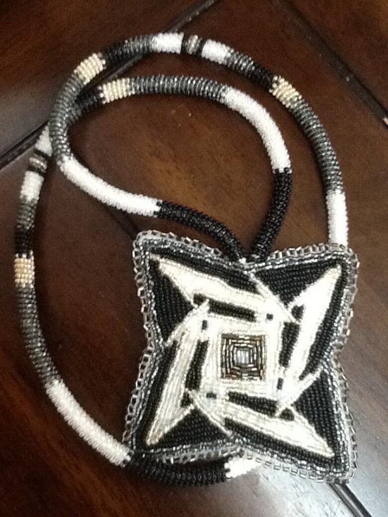 The medallion beaded by Sipi Flamand.