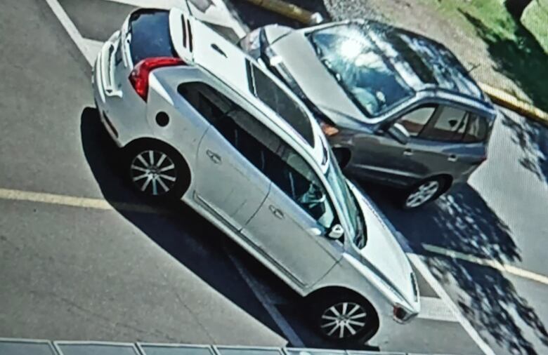 A 2015 white Volvo XC60 that seen from a surveillance camera in the mall parking lot at the time of the shooting.