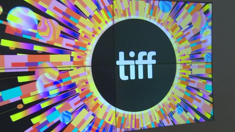 A TIFF logo with colorful blocks around them. 