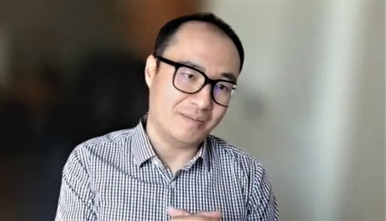 George Jia with blurred background